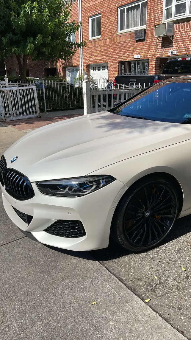 Post-cleaning picture of white BMW up close