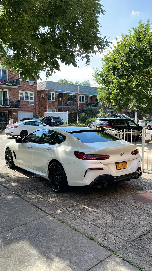 Post-cleaning picture of white BMW from rear