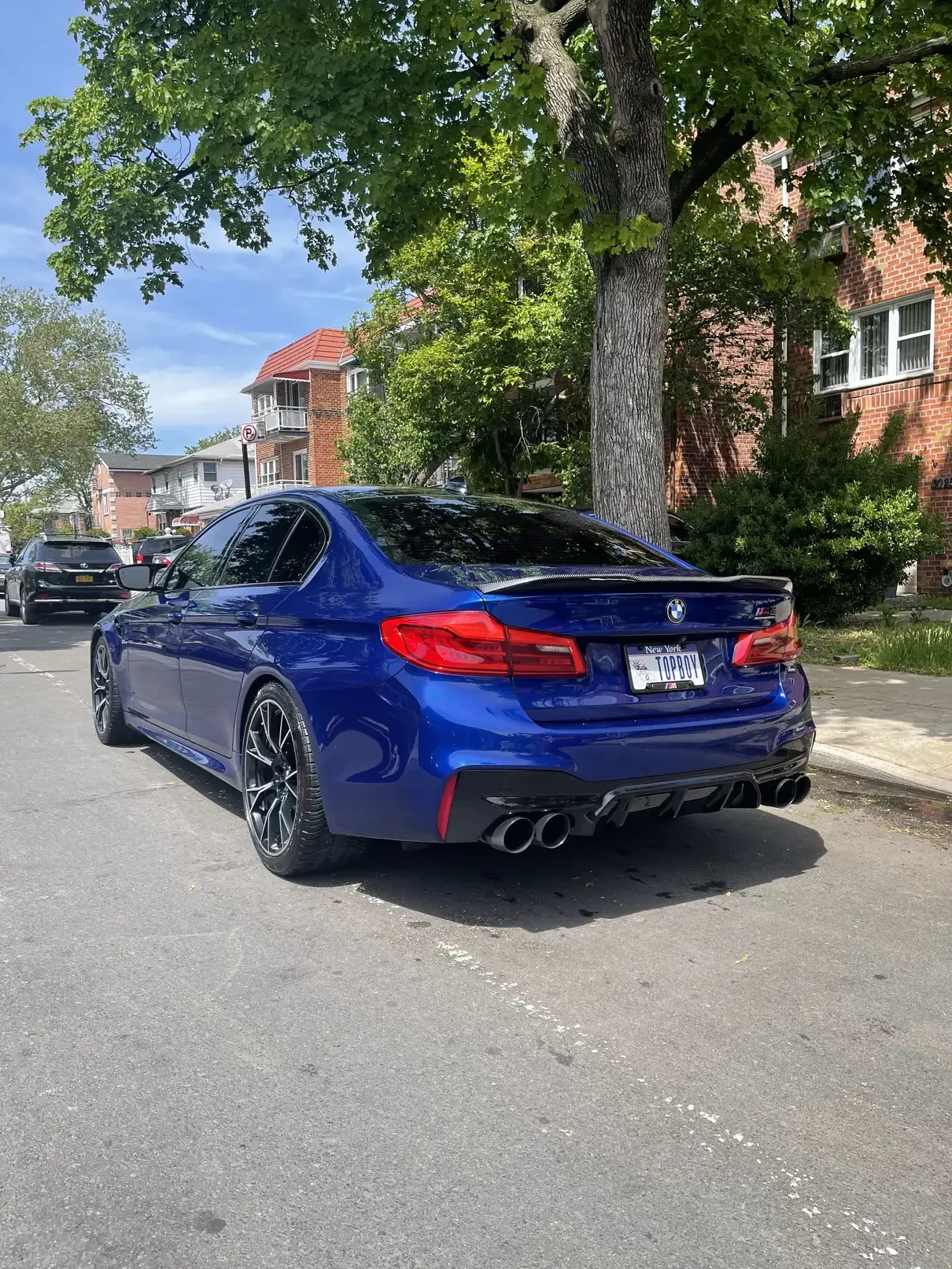 Blue bmw m5 rear picture from far after cleaning.